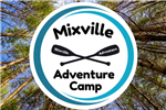 Mixville Adventure Camp with oars on photo of tall trees
