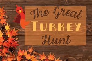 wood background with fall leaves, pinecones and seeds a clipart turkey and the words The Great Turkey Hunt