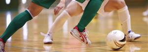 picture of feet playing soccer on gym floor