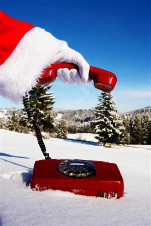 image of santa hand holding phone in snow