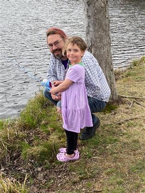 image of family fishing